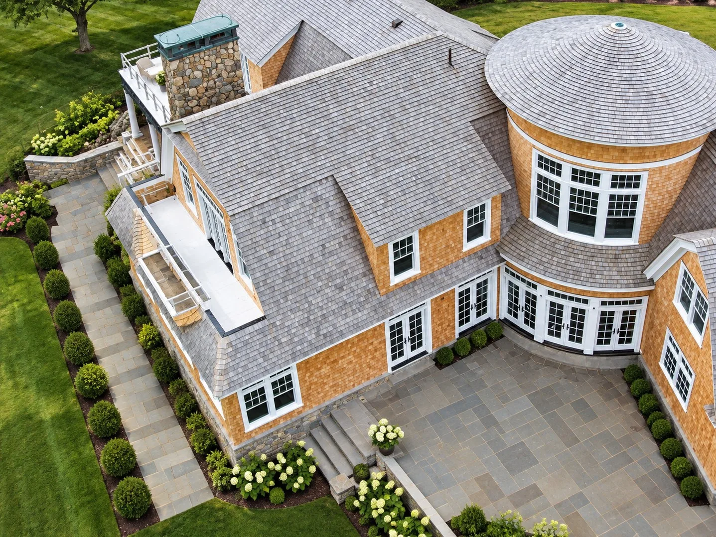 The same house from above, shingled and landscaped