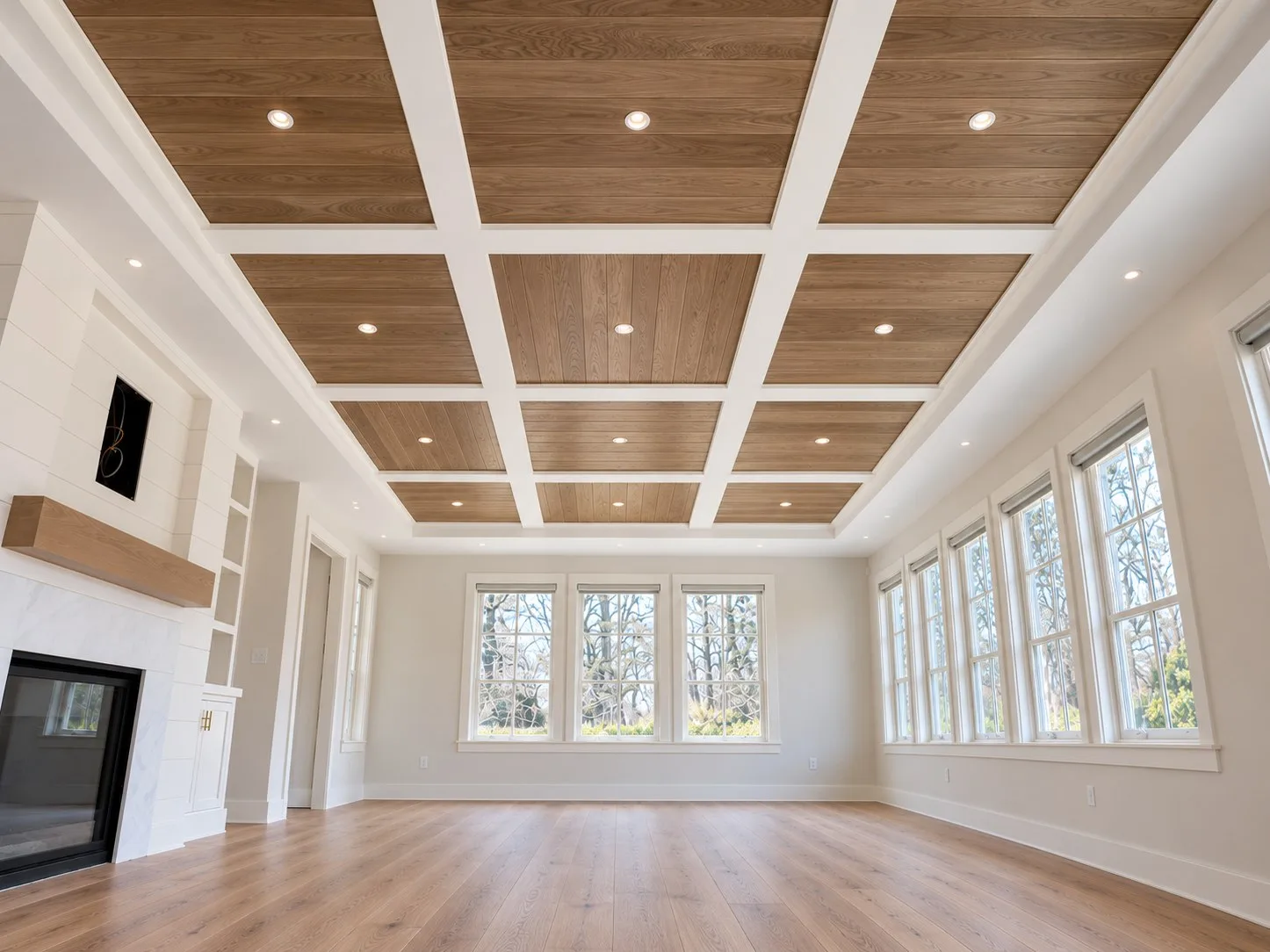 The same coffered ceiling finished with white oak panels and trimmed beams